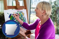 arkansas map icon and an artist painting a picture