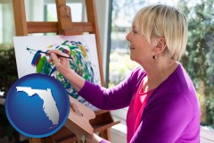 florida map icon and an artist painting a picture