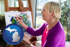 michigan map icon and an artist painting a picture